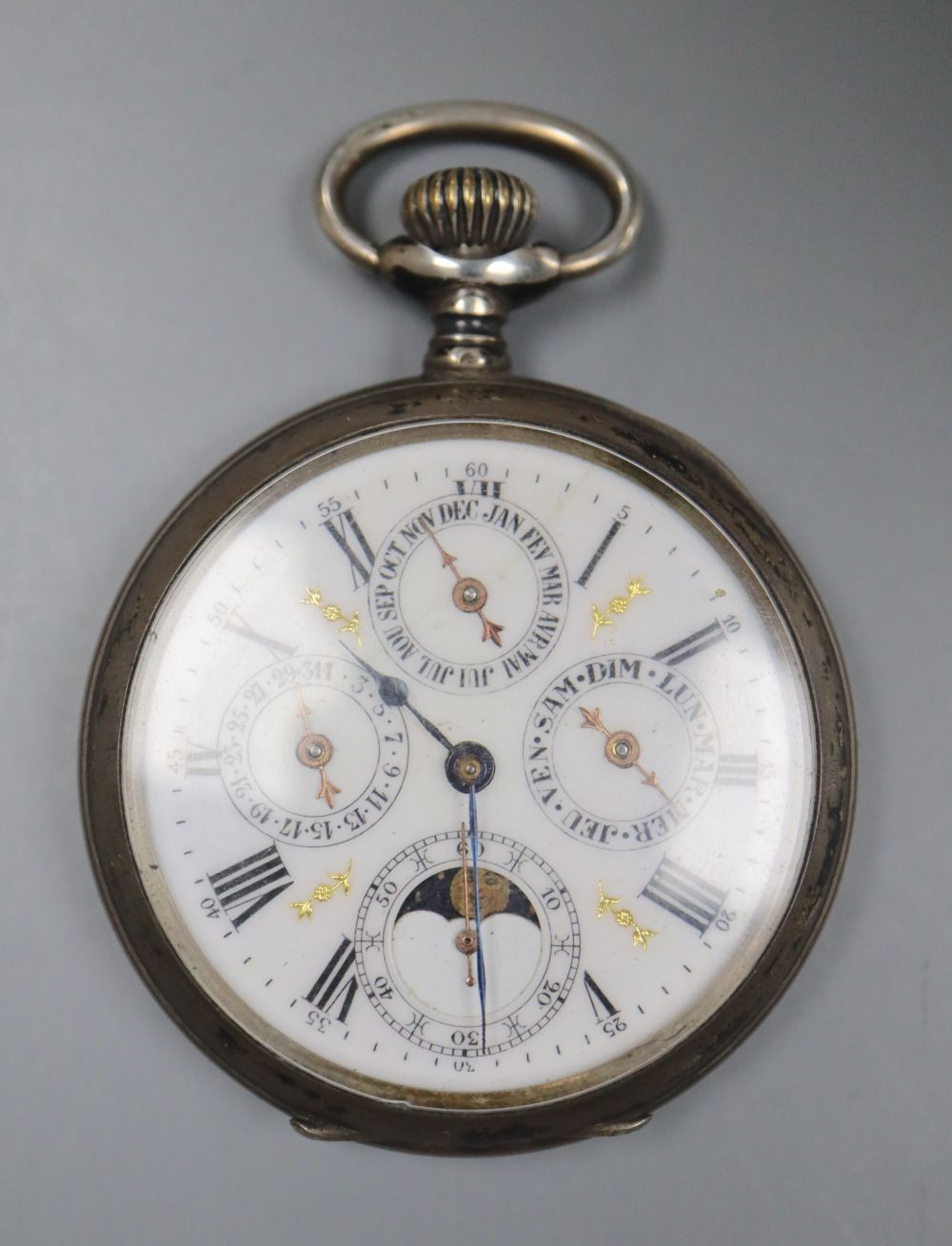 A white metal calendar moonphase keyless pocket watch.